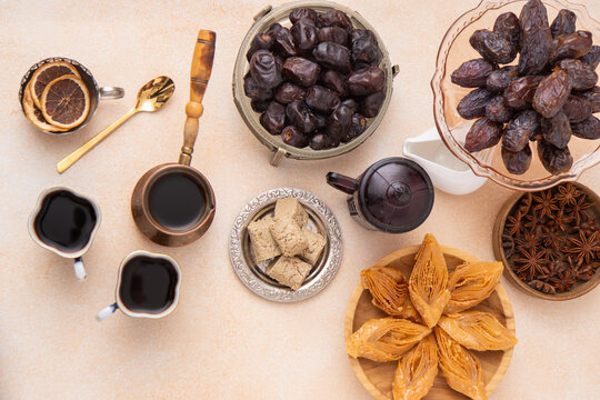 Ramadan Sweet Treats and Coffee Assortment on the table. Baklava, halva for dessert. Food and drink. Dates fruit top view