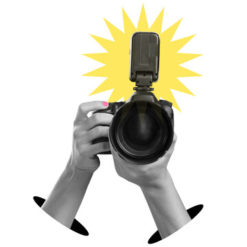 Two hands hold a camera aimed at the viewer with a flash on top. The background is clear, showing only the camera and hands. This setup is ideal for taking photos.
