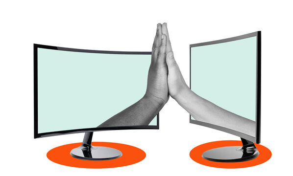 Two computer monitors stand facing each other with hands reaching out to touch. The setting shows the idea of virtual connection or communication, emphasizing technology's role in connecting people.