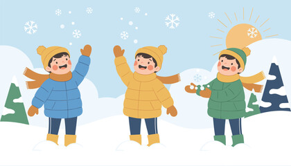 Fototapeta premium Three cheerful young children in warm winter jackets and hats playing with snowballs on a sunny winter landscape.