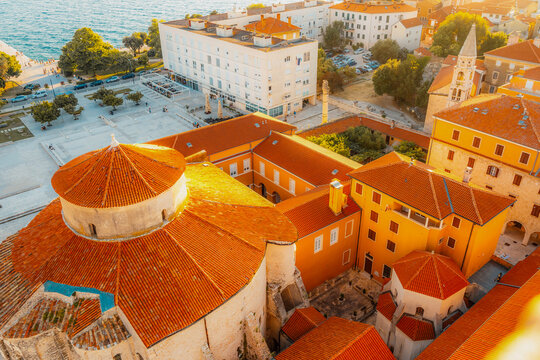 Zadar, Croatia. Old town street of Zadar with the Church of St. Donatus and the bell tower of the Cathedral of St. Anastasia at sunset.