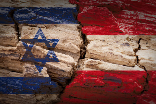 Israel and Austria flags painted on a cracked wall representing international relations