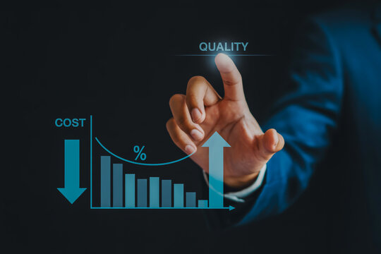 Hand of businessman points to graph showing lower cost and higher quality.