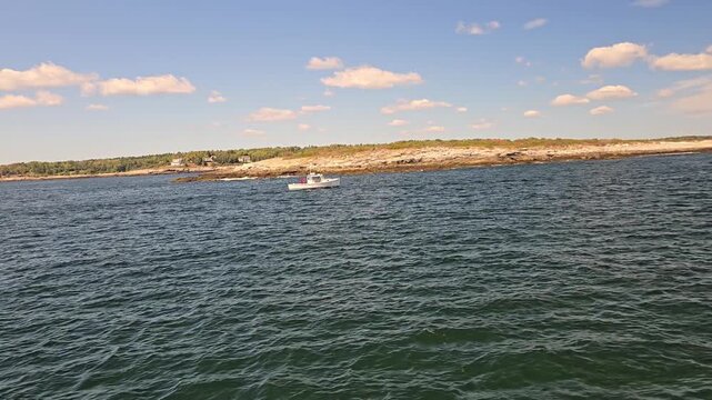 L:obster boat cruising near Casco Bay Island