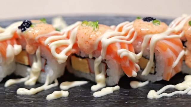 Fresh salmon roll sushi made with seasoned rice and sliced salmon, presented as an elegant Japanese dish with delicate texture and savory seafood flavor.