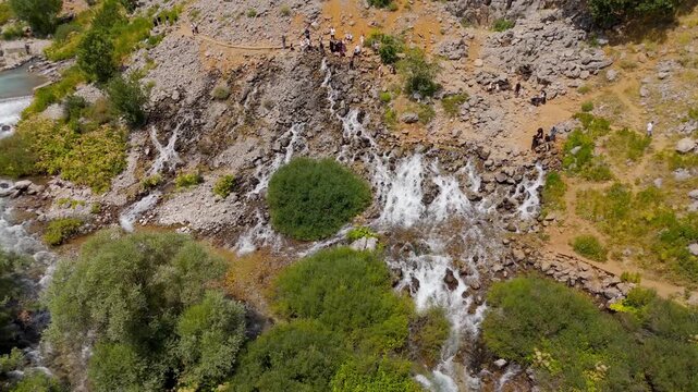 Rugged terrain flows with a clear, rushing stream (Munzur Gozeleri Ovacik Tunceli)
