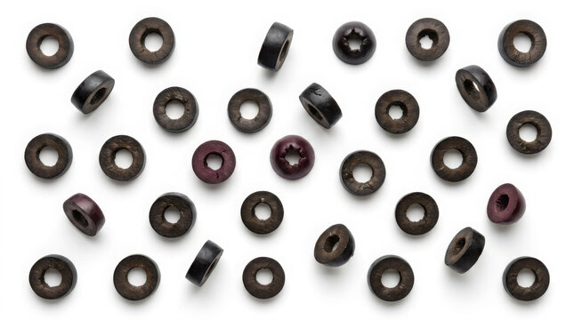 Sliced olives scattered randomly on a clean background, viewed from generated, using ai