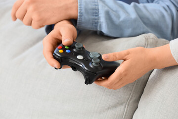 Gaming and entertainment, friends playing video games together with a controller at home for leisure and digital recreation in a casual living room © Pixel-Shot