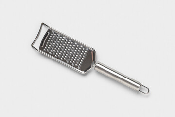 Food preparation and cooking, stainless steel kitchen grater for cheese and vegetables, culinary tool for home and restaurant kitchen equipment © Pixel-Shot