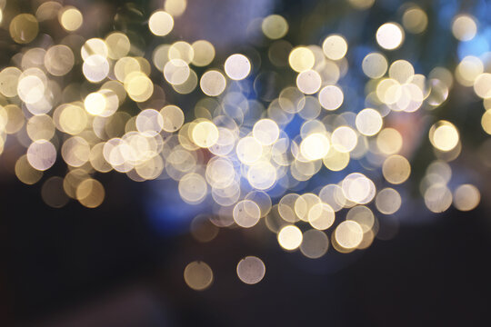Golden New Year bokeh, abstract background with blurred circles.