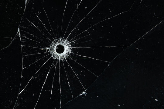 Bullet holes on black glass, overlay design background