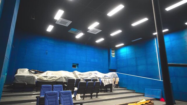 Glowing brightly led lamps over reconstructed cinema hall at amusement center. Maintaining movie theater to provide qualitative service