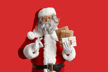 Fototapeta premium Santa Claus with letters on red background
