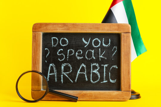Language learning and education, do you speak Arabic written on a chalkboard with a United Arab Emirates flag and magnifying glass on yellow background