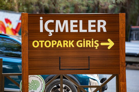 Sign of Icmeler Cove Beach parking entrance in Dilek Peninsula National Park. Kusadasi, Turkiye - August 22, 2026.