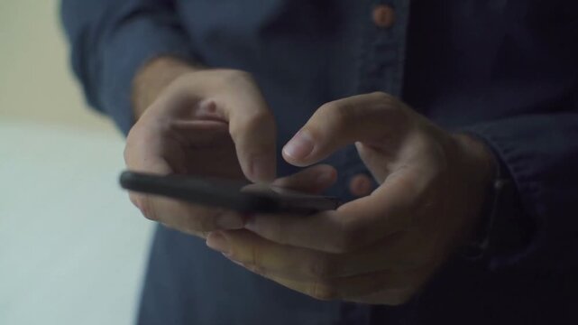 Man Typing Messages on Smartphone Close Shot