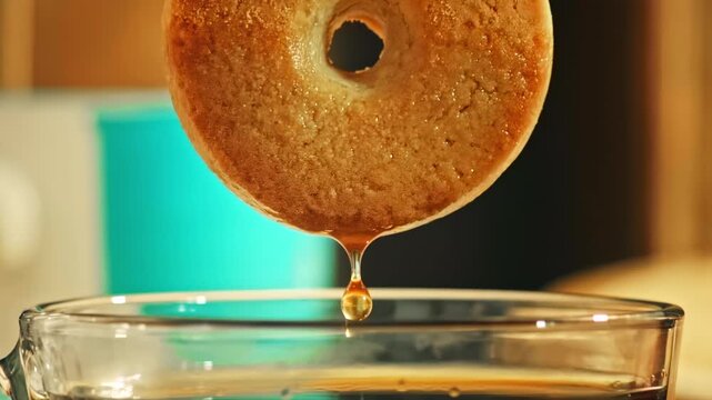 Biscuit being dipped into creamy liquid at 1000 fps in extreme macro close-up, capturing delicate droplets, rich texture and a delicious, indulgent moment of slow-motion food immersion.