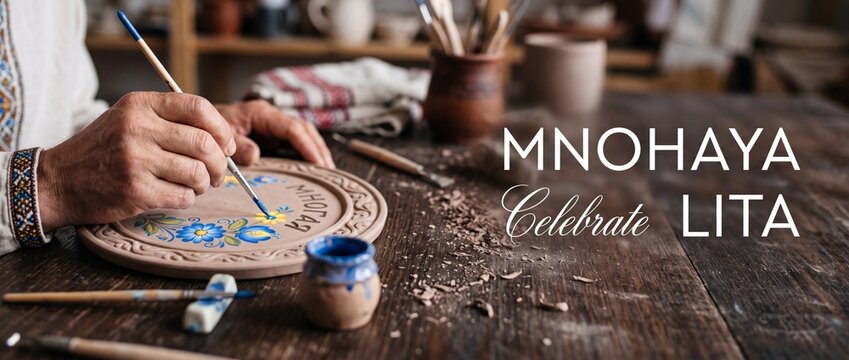 Artisan painting ceramic plate traditional folk art craft in pottery workshop studio, close up of craftsperson hands decorating handmade clay dish with blue floral ornament design.