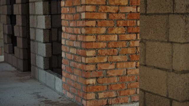 Exposed brick and concrete block walls in unfinished building
