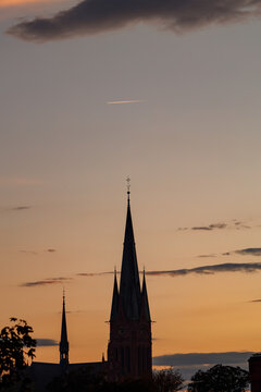 Spire of St Catherine church in Torun Poland at sunset