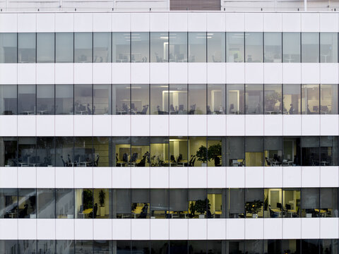 Aerial view of underutilized modern office building with empty workspaces