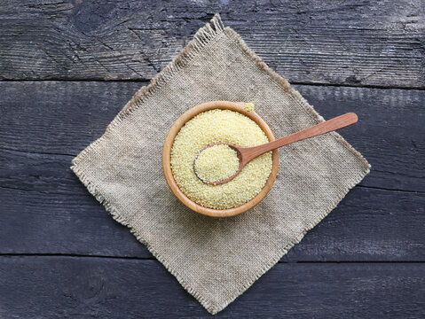 Raw Couscous in a Wooden Bowl