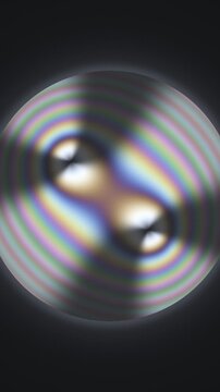 Conoscopic Interference Figure With Swinging Isogyre Brushes In Polarized Light Seamless Loop in subtle gray tones vertical 9:16