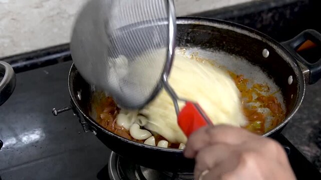 Close-up of cooking macaroni pasta at home