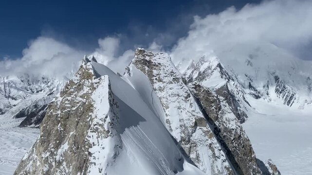 Snow-Covered Mountains sweeping view Captured standing at 20,000 Feet with Glaciers, Crevasses and Glacial Moraines Below