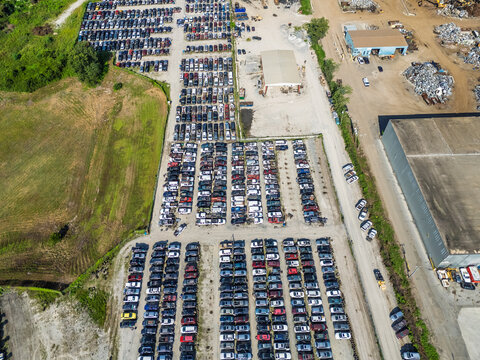 Aerial view of Cape Fear Pick N Pull featuring rows of salvaged cars, scrap metal piles, and industrial buildings in Wilmington, North Carolina, United States.