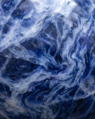 Fototapeta premium Abstract Macro Photography of Natural Blue Sodalite Stone with Intricate White Veined Texture