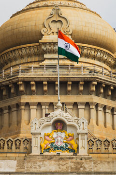 Indian national flag flying in front of Vidhana Soudha in Bangalore, Karnataka, India, showcasing the iconic government landmark, national pride, and Indian architectural heritage.