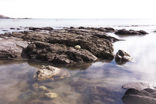 Wembury Coastline With The Tide Coming In In Long Exposure