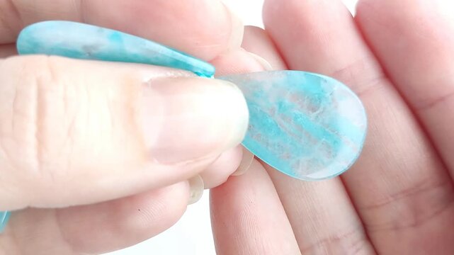 Polished turquoise amazonite teardrop gemstone pendant displaying vibrant blue green color variations and natural mineral patterns for jewelry making supplies