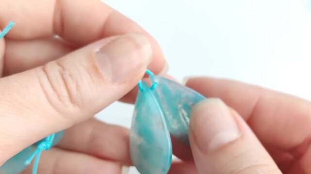 Polished turquoise amazonite teardrop gemstone pendant displaying vibrant blue green color variations and natural mineral patterns for jewelry making supplies
