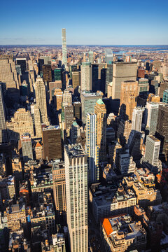 Elevated skyline view of dense Midtown Manhattan skyscrapers at sunset. Murray Hill, New York City, USA