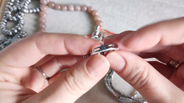 Detailed overview of premium jewelry making components showcasing polished metallic clasps, sparkling rhinestone rings, and smooth natural gemstone beads arranged for artisan design projects.