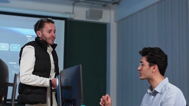 Two Tech Colleagues Discussing Project in Modern Office