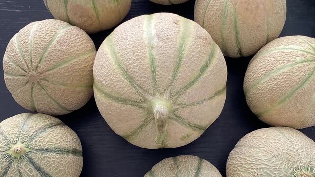 Fresh melons with textured rind at the farmers' market