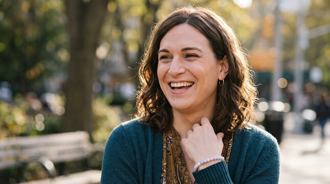 Smiling trans woman expressing transfeminine joy outdoors for trans woman portrait, transgender female representation, lgbtq identity awareness, and gender transition educational blogs