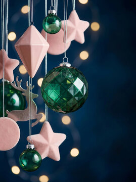 Christmas  background of pastel pink and dark green elegant ornaments on dark blue background. Space for text. 