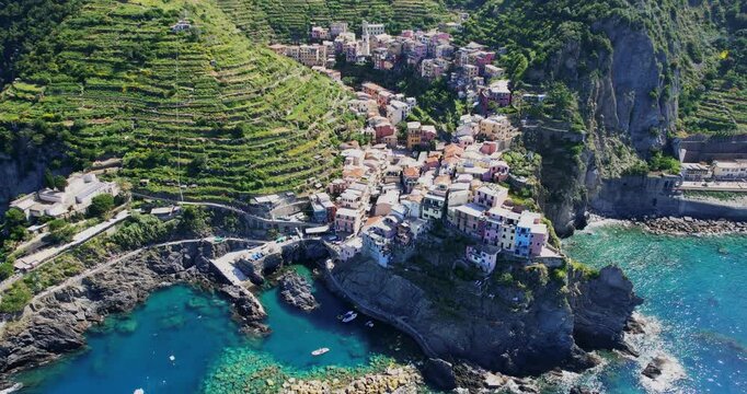Scenic aerial view of Manarola village in Cinque Terre, Italy, by the sea