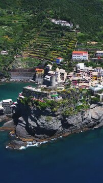 Drone panoramic view of Doria tower and bustling beauty of Vernazza, Cinque Terre