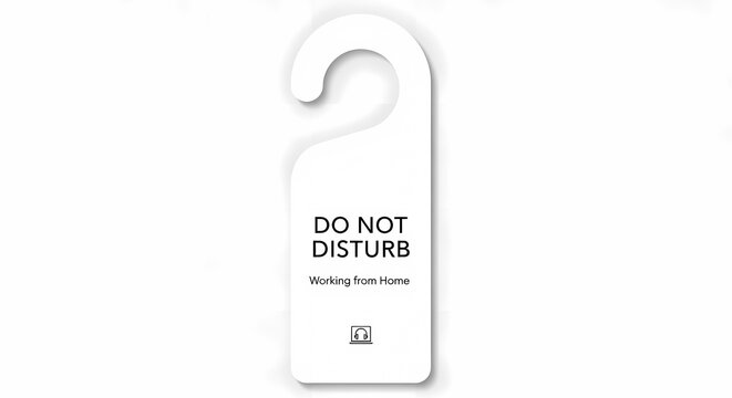 White do not disturb sign hanging on a door handle with clean background.
