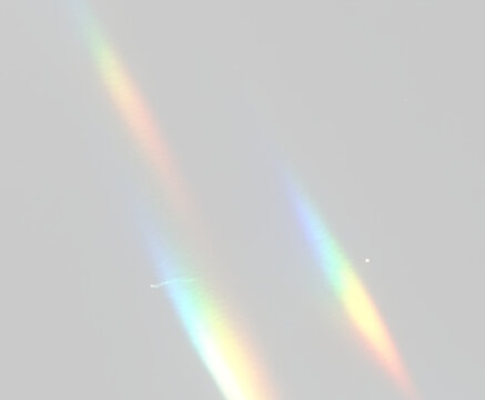 Rainbow lens effect png with diamond crystal shine, prism reflections, glowing rays and transparent fantasy composition.