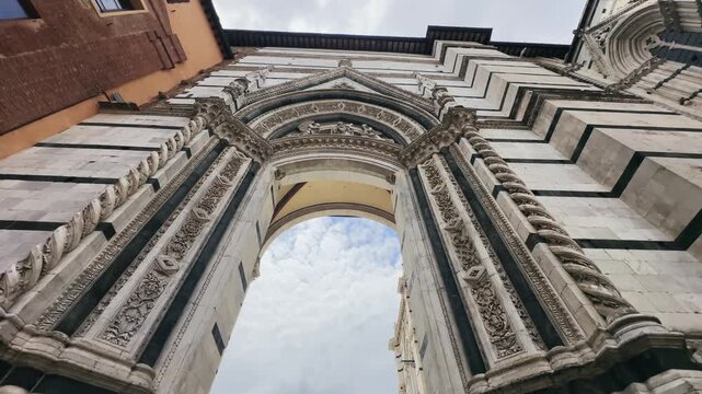 Magnificent detailed archway of a historic Duomo cathedral building in Siena, Tuscany