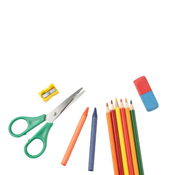 Assorted school stationery including green scissors, colorful pencils, wax crayons, a pencil sharpener, and... isolated on a transparent background