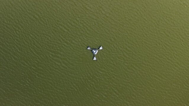 Aerial view of a floating water quality monitoring device on the surface of Gaynor Lake in Boulder County, Colorado, United States.