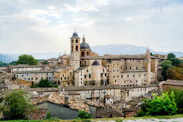 Fototapeta premium View of Palazzo Ducale and the cathedral rising above the historic center of Urbino, Marche, Italy