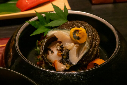 Fresh abalone served in its shell at Takefue ryokan, Aso District, Kumamoto, Japan